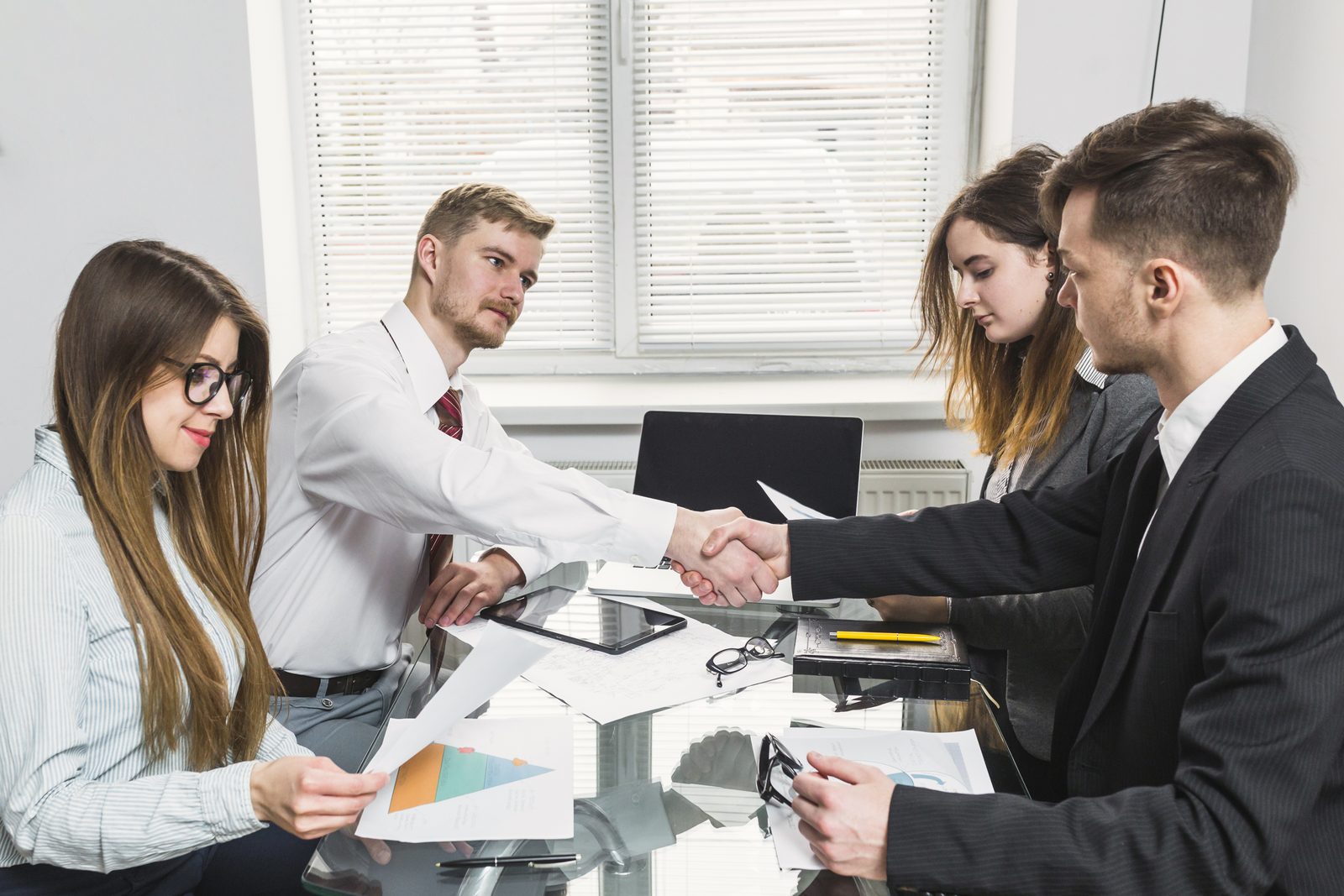 businessman-shaking-hand-with-his-colleague-office.jpg